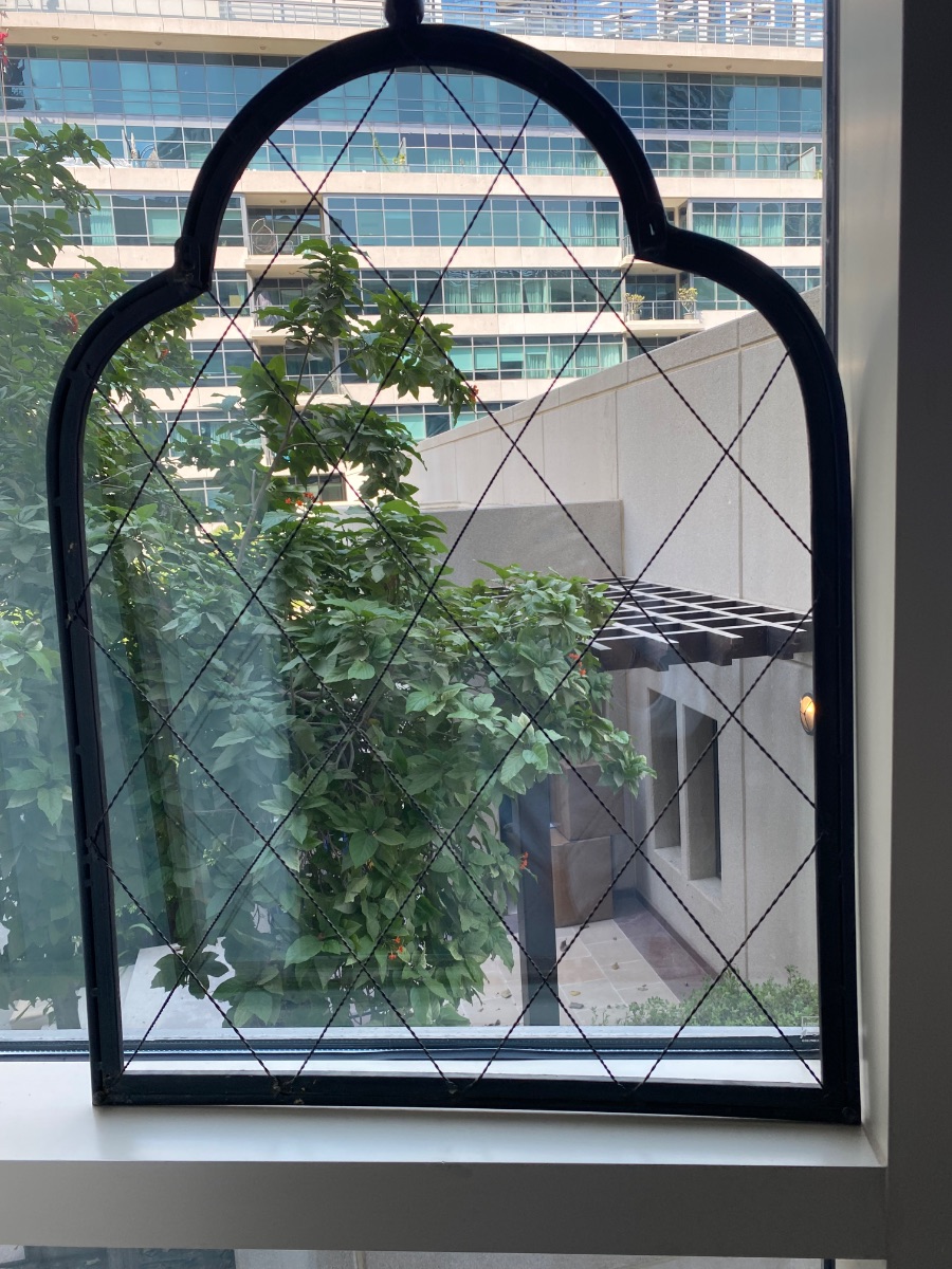 distressed black metal window-pane frame or decorative trellis with a diamond lattice pattern. photo 3