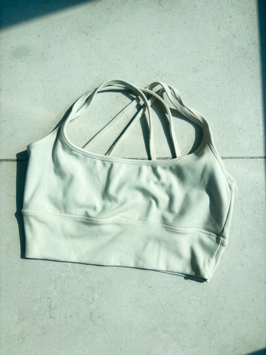 The Giving Movement Cream sports bra