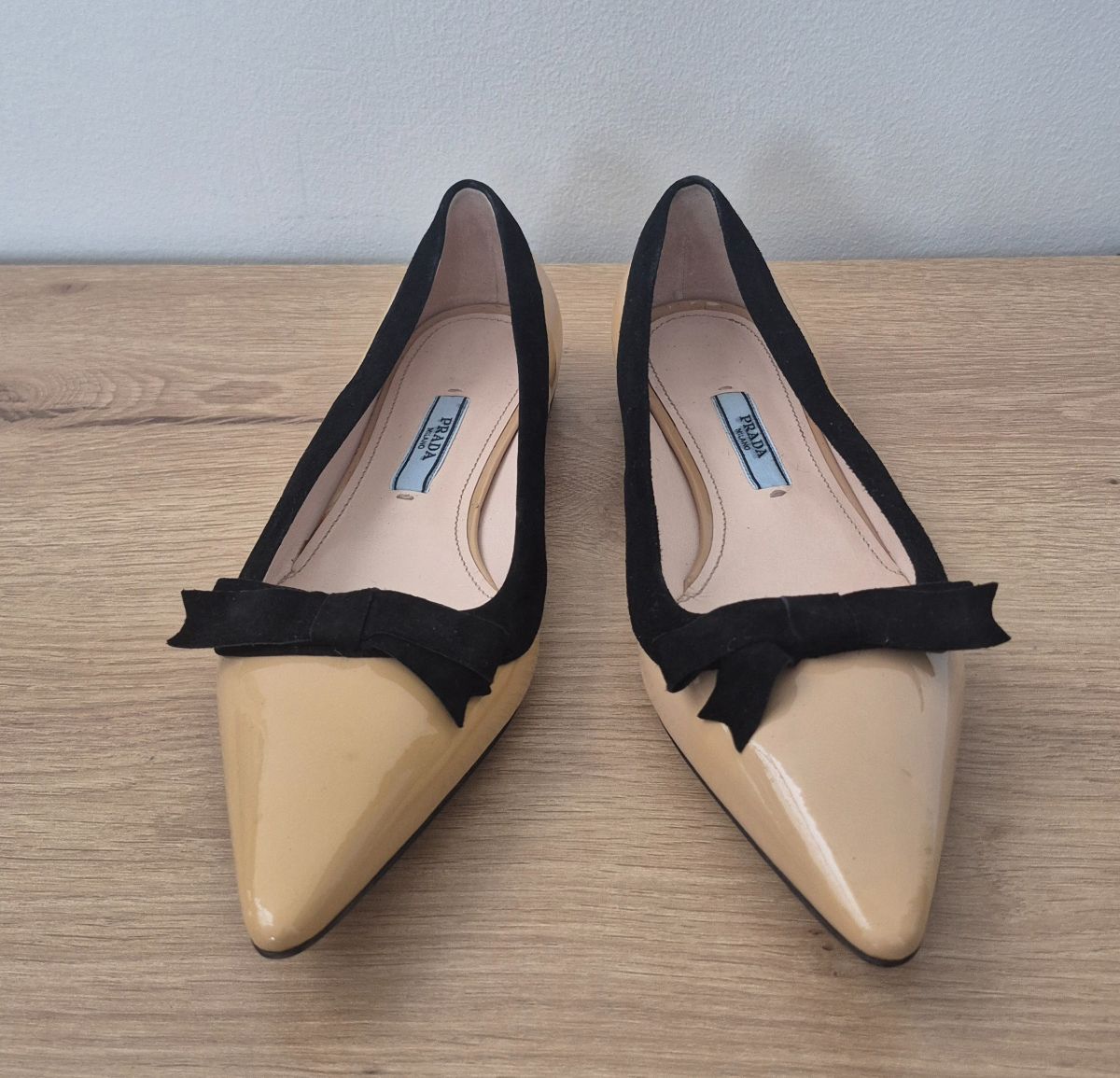 Prada yellow patent pumps with bow