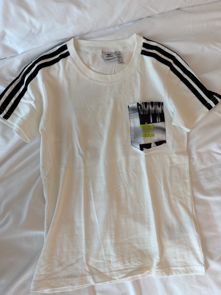 Adidas Originals white t-shirt with black stripes and pocket design