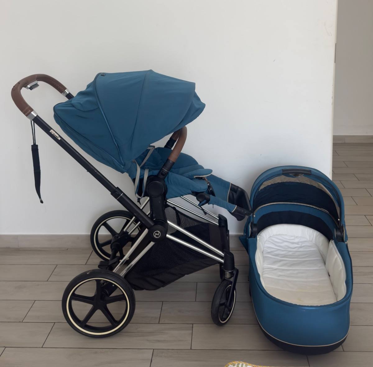 A Cybex stroller with bassinet, listed on Loop