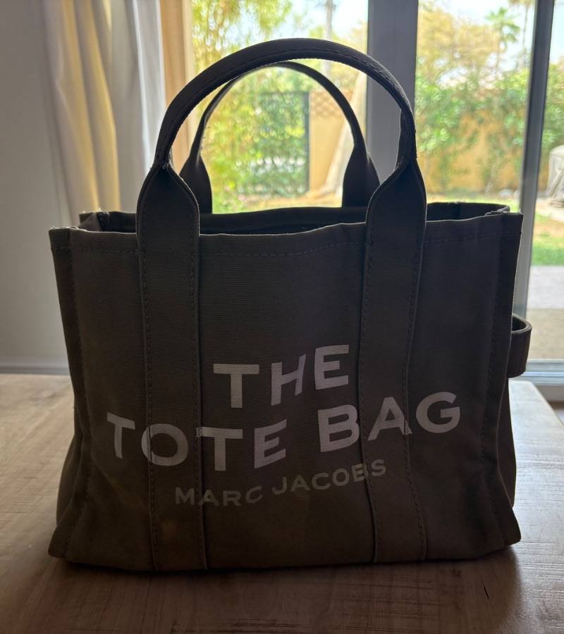 A Marc Jacobs canvas tote bag listed on Loop