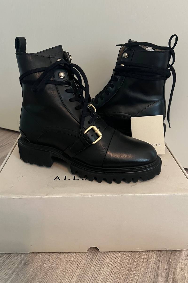 Black AllSaints lace up boots on their box, listed on Loop
