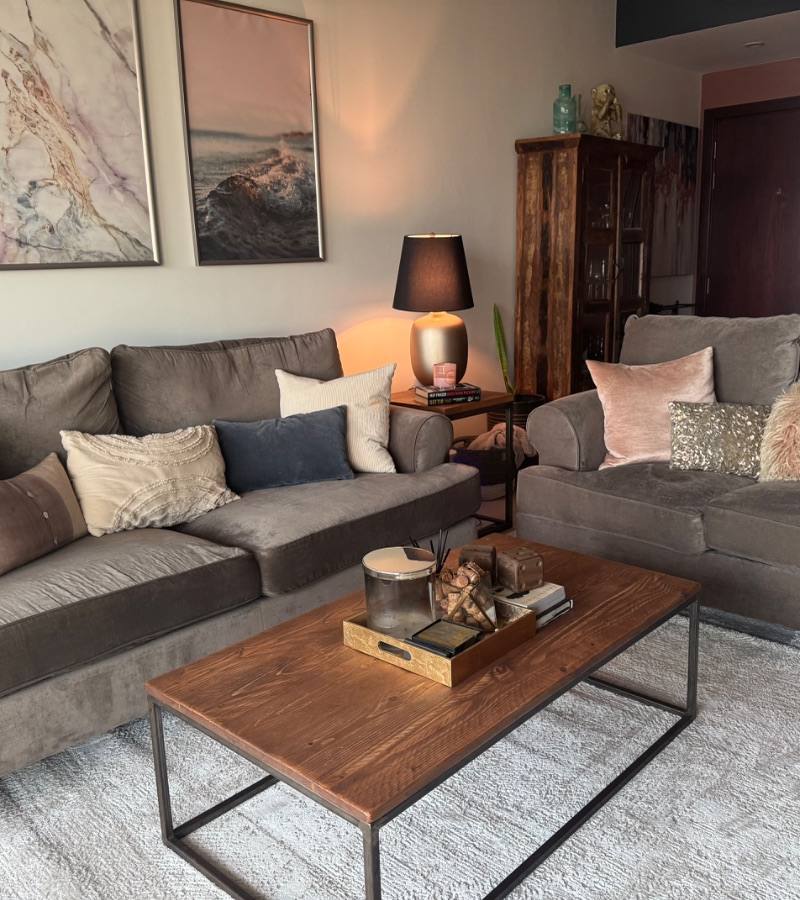 Grey and beige sofas in a Dubai living room, listed on Loop