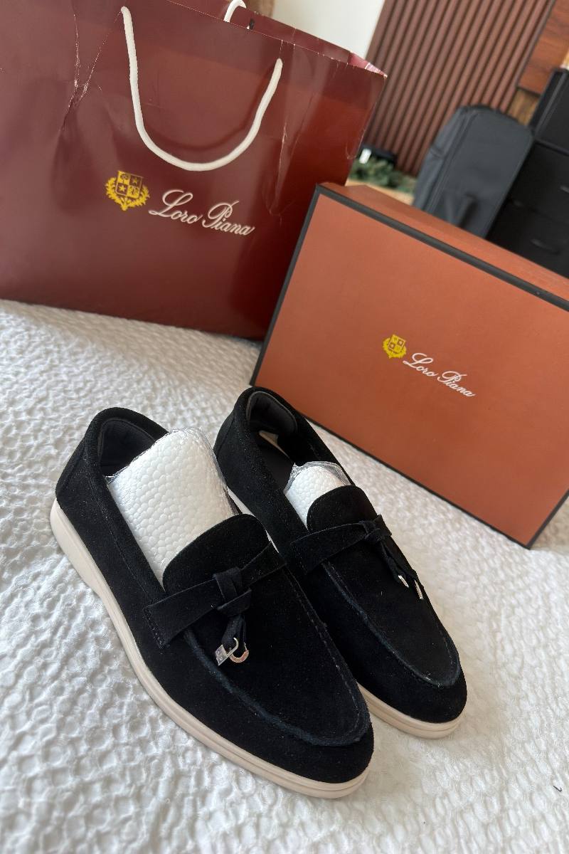 Designer loafers shown with their original box and bag, listed on Loop